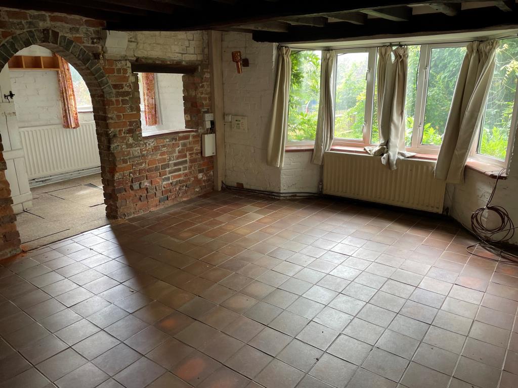 Lot: 69 - CHARACTER COTTAGE IN NEED OF UPDATING AND REPAIR - Dining room with views over rear garden